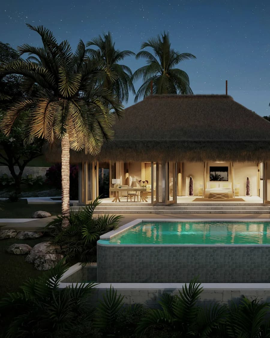 A lit luxury villa with a swimming pool and palm trees at twilight